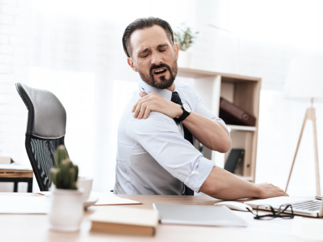 A young man having pain from Rotator Cuff Injury