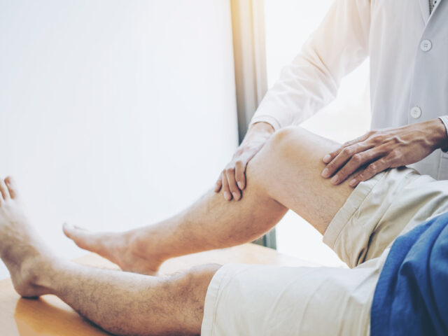 Orthopedic Doctor consulting with patient Knee problems