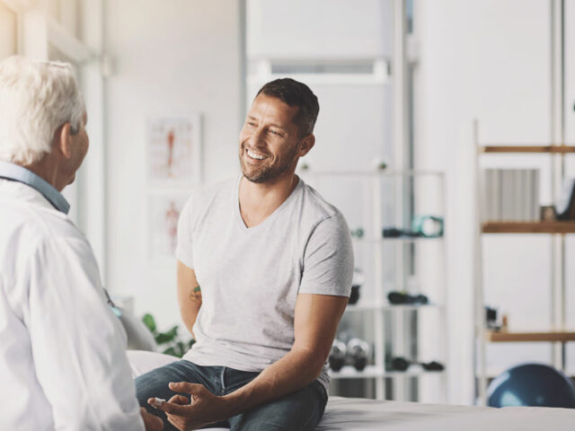 Male patient discussing physical therapy recommendations with Orthopedic Doctor.